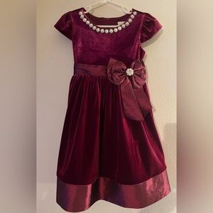 Burgundy velvet tie back dress with decorative collar and bow